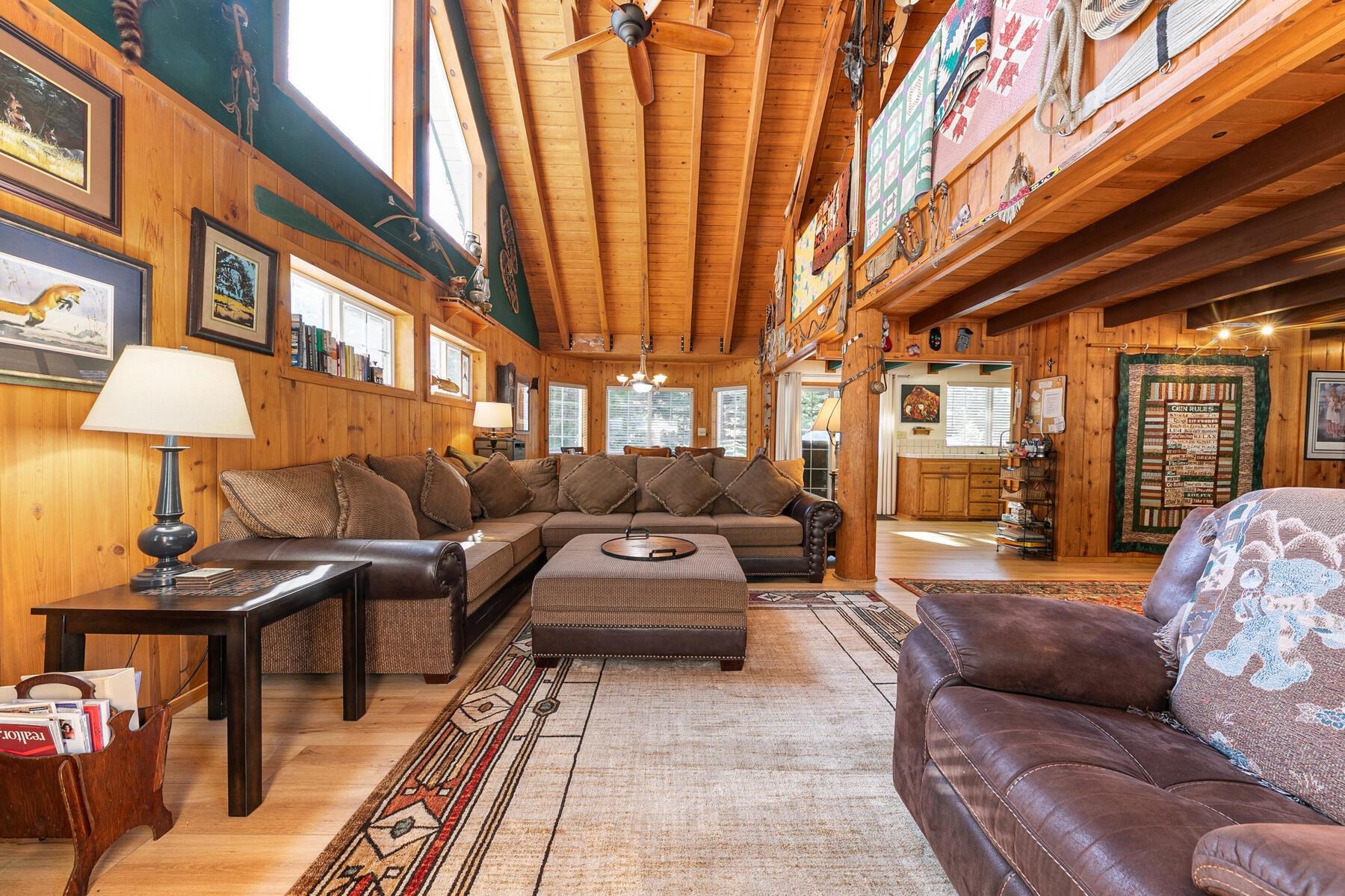 5749 Dodowah Road Carnelian Bay, CA 96140 - Photo 7 of 28 a living room with furniture and a lamp