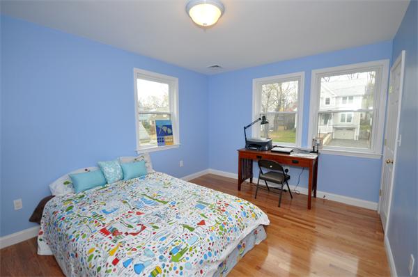31 Bridge Street Lexington, MA 02421 - Photo 11 of 20 a bedroom with a bed and a table