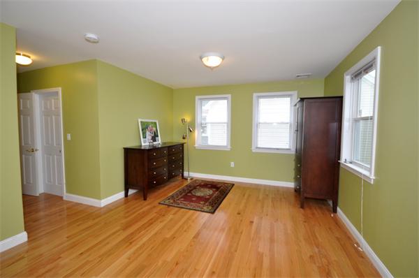 31 Bridge Street Lexington, MA 02421 - Photo 10 of 20 a view of empty room with wooden floor and fan