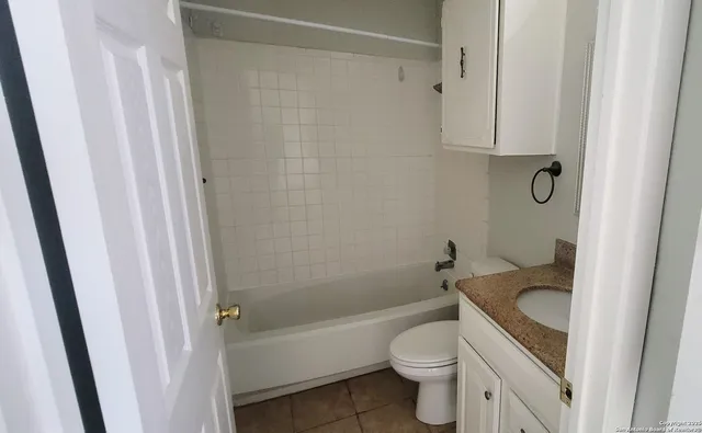 a bathroom with a sink a toilet and a bathtub
