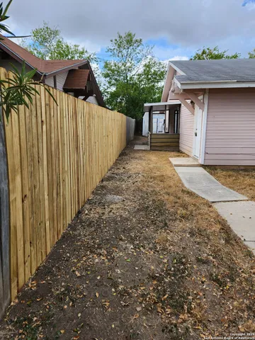 a view of a house with a yard and garage