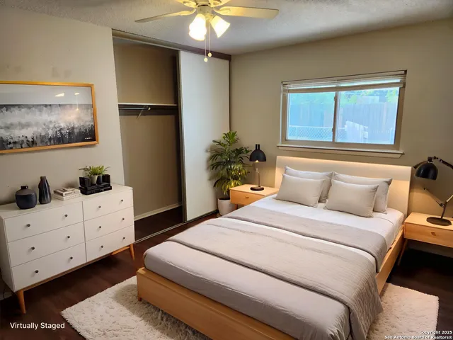 a bedroom with a bed and a window