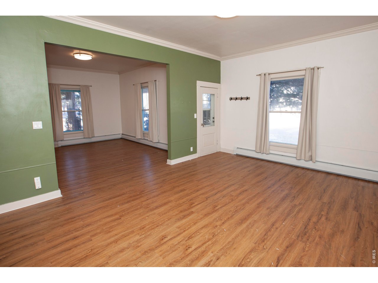 301 South 2nd Street Sterling, CO 80751 - Photo 13 of 49 a view of an empty room with window and wooden floor