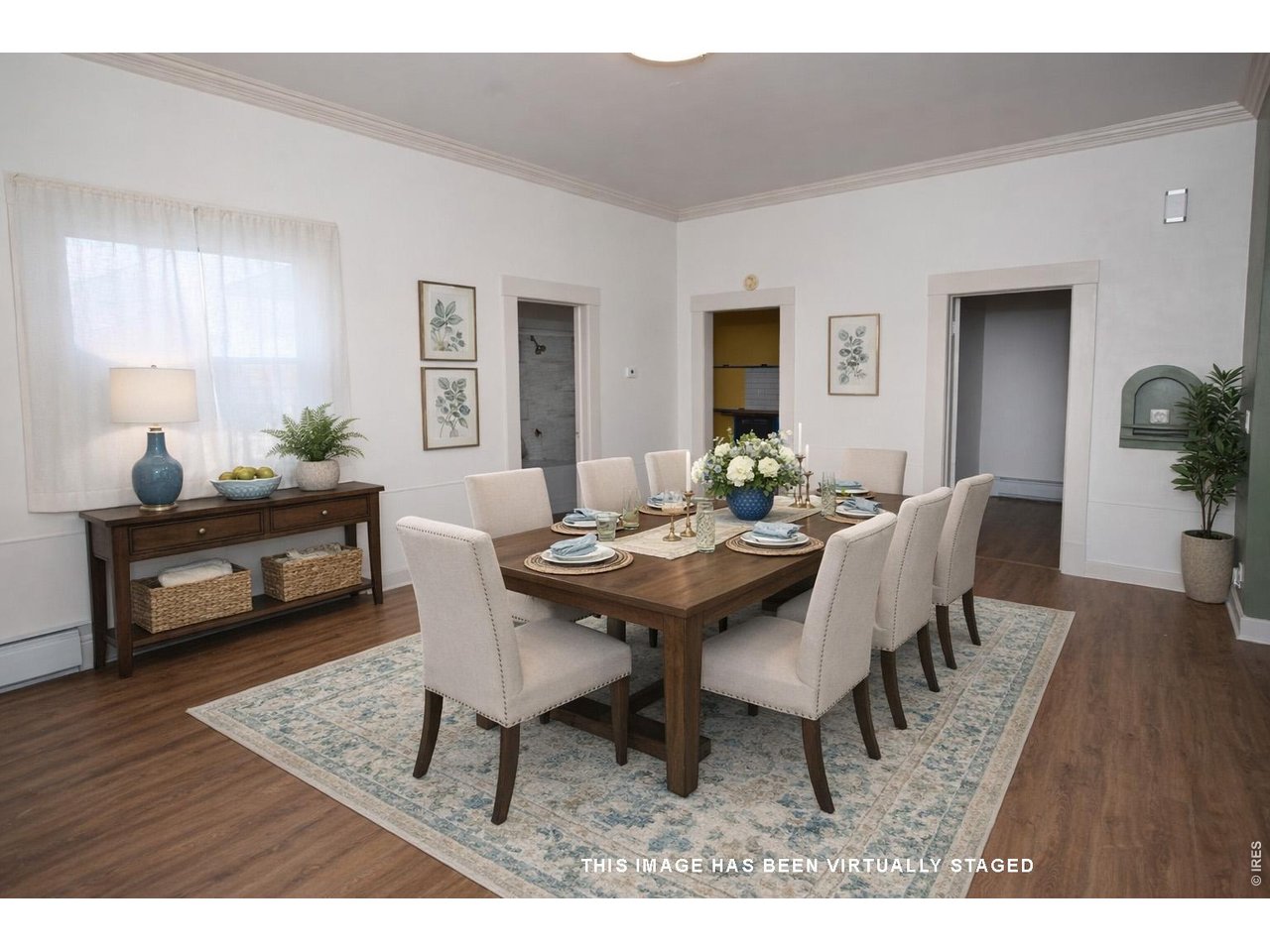 301 South 2nd Street Sterling, CO 80751 - Photo 15 of 49 a view of a dining room with furniture and wooden floor
