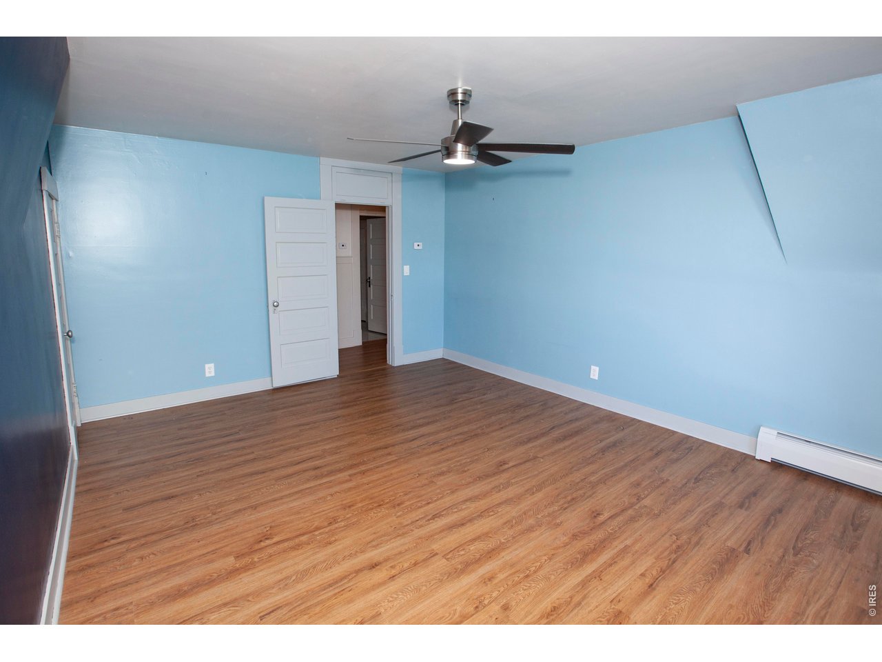301 South 2nd Street Sterling, CO 80751 - Photo 20 of 49 a view of an empty room with wooden floor