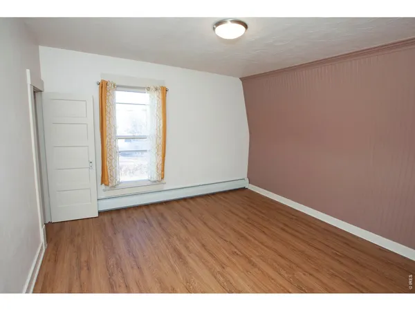 a bathroom with a toilet and a bathtub