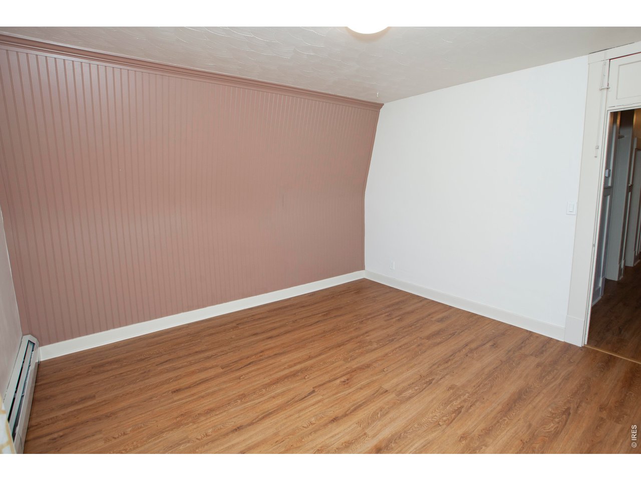 301 South 2nd Street Sterling, CO 80751 - Photo 27 of 49 a view of an empty room with wooden floor