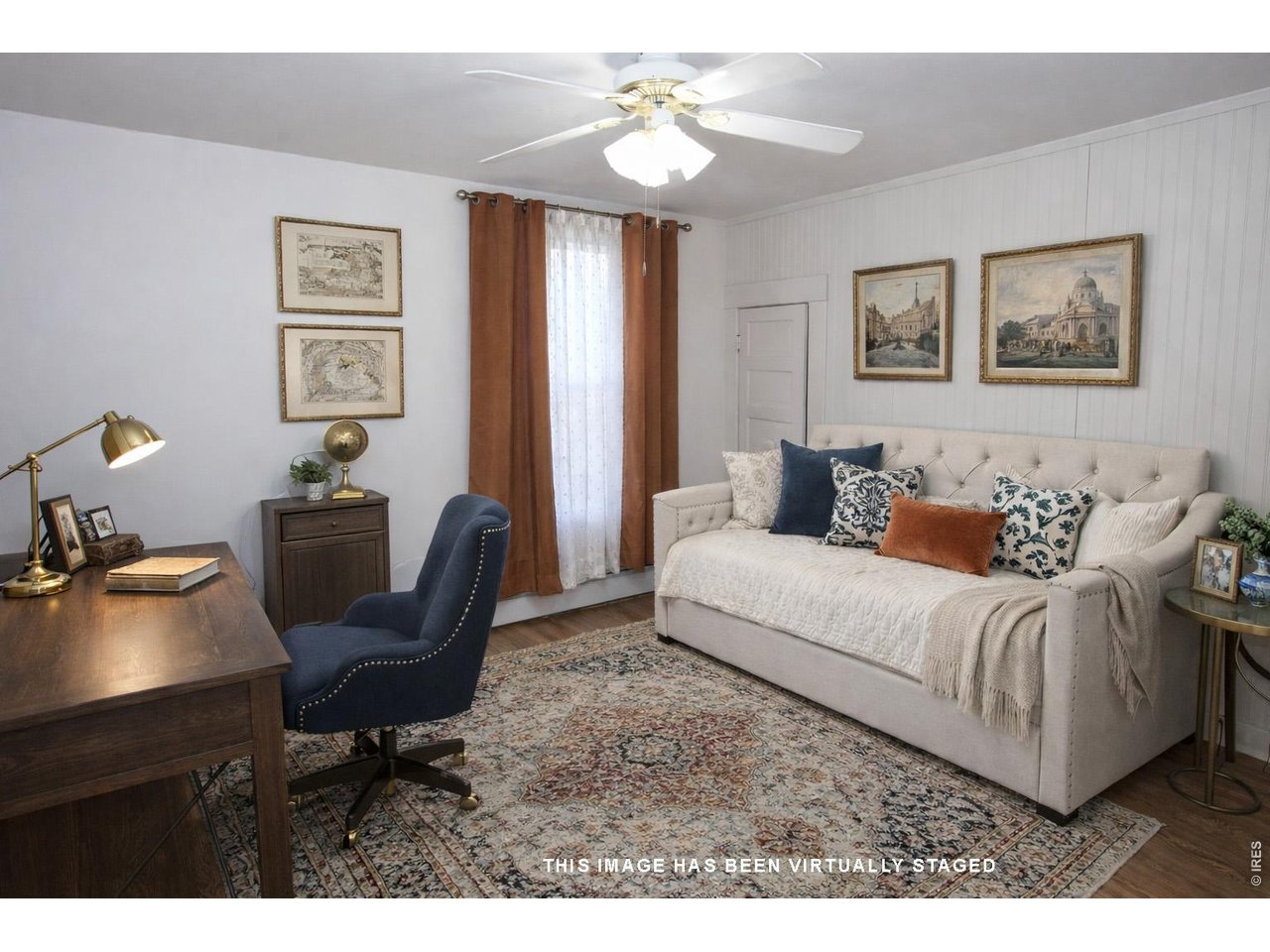 301 South 2nd Street Sterling, CO 80751 - Photo 36 of 49 a living room with furniture and a chandelier