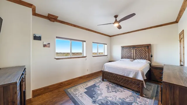 a bed room with a bed and a large window