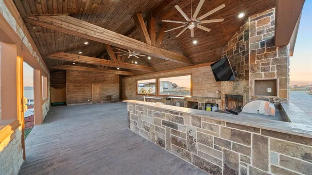 a living room with lots of furniture and a chandelier