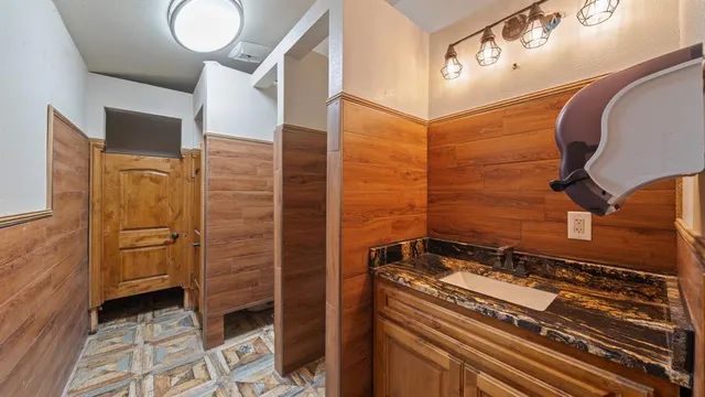 a living room with furniture potted plant and a window