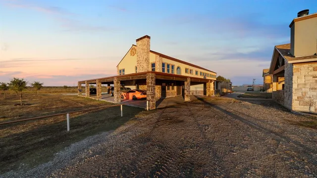 a living room with fireplace furniture and a flat screen tv