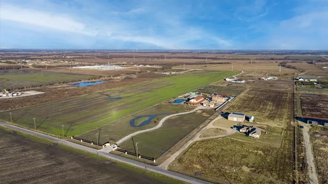 an aerial view of a house with a ocean view