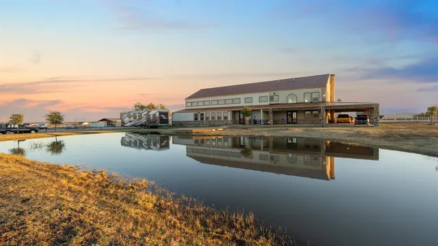 a living room with furniture fireplace and wooden floor