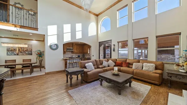 a kitchen with stainless steel appliances granite countertop lots of counter top space and wooden floor