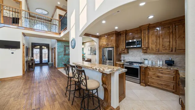 a kitchen with cabinets and stainless steel appliances