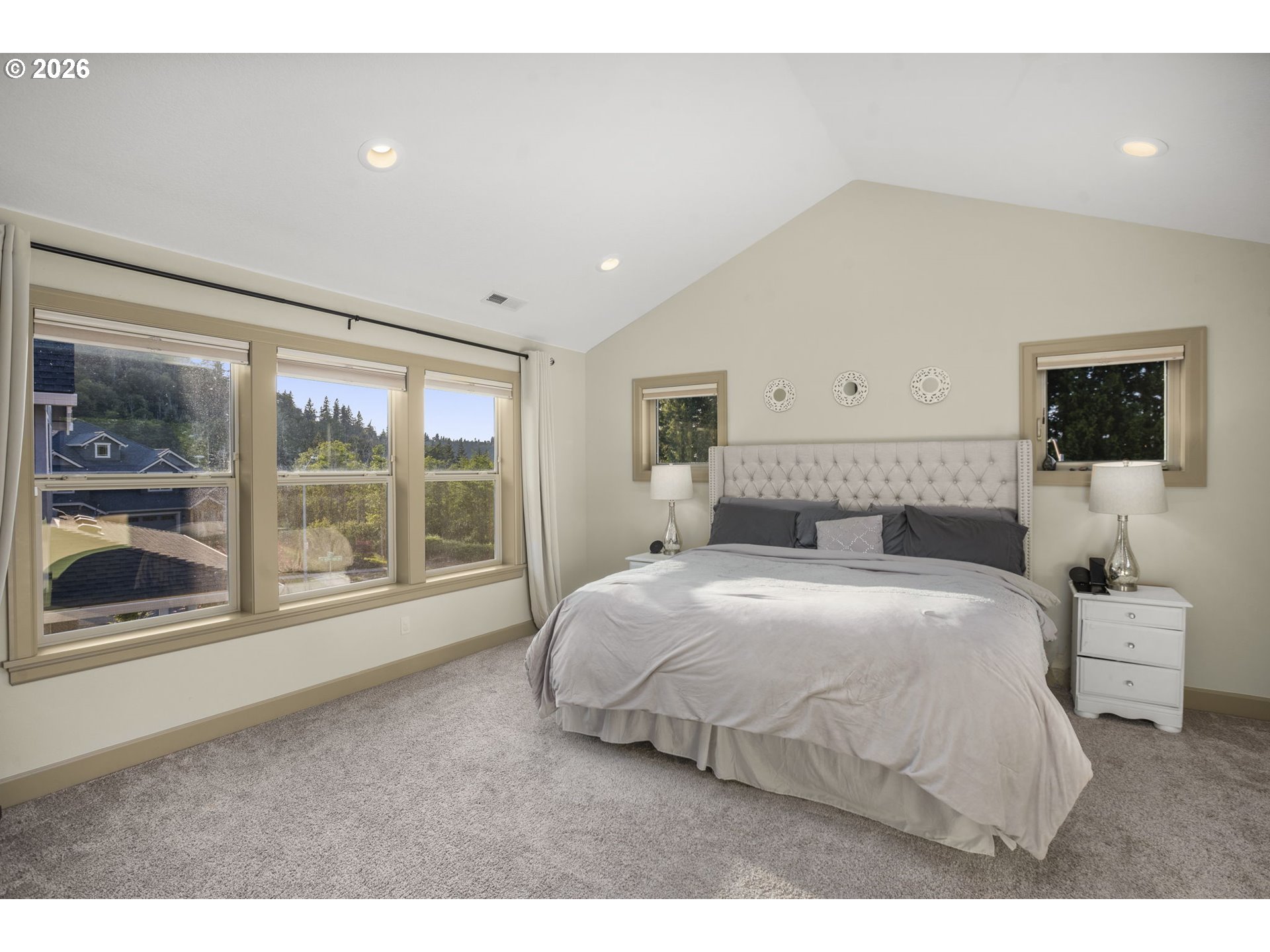 1668 Southeast 35th Terrace Gresham, OR 97080 - Photo 11 of 33 a bedroom with a large bed and a large window
