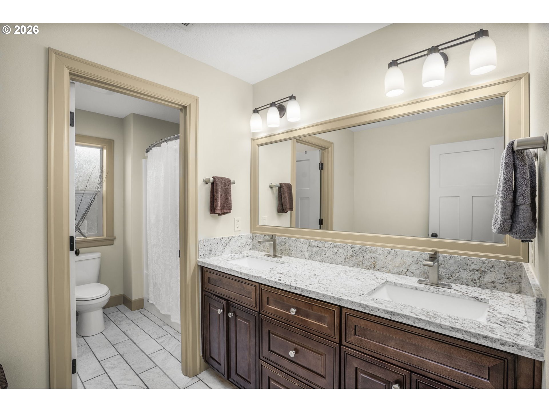 1668 Southeast 35th Terrace Gresham, OR 97080 - Photo 20 of 33 a bathroom with a granite countertop sink a toilet and a mirror