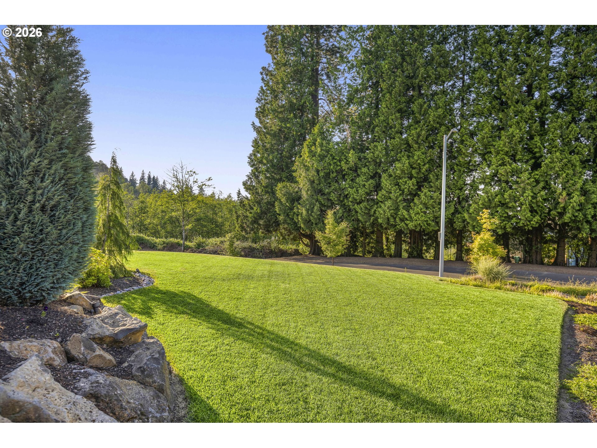 1668 Southeast 35th Terrace Gresham, OR 97080 - Photo 26 of 33 a view of a field with a tree