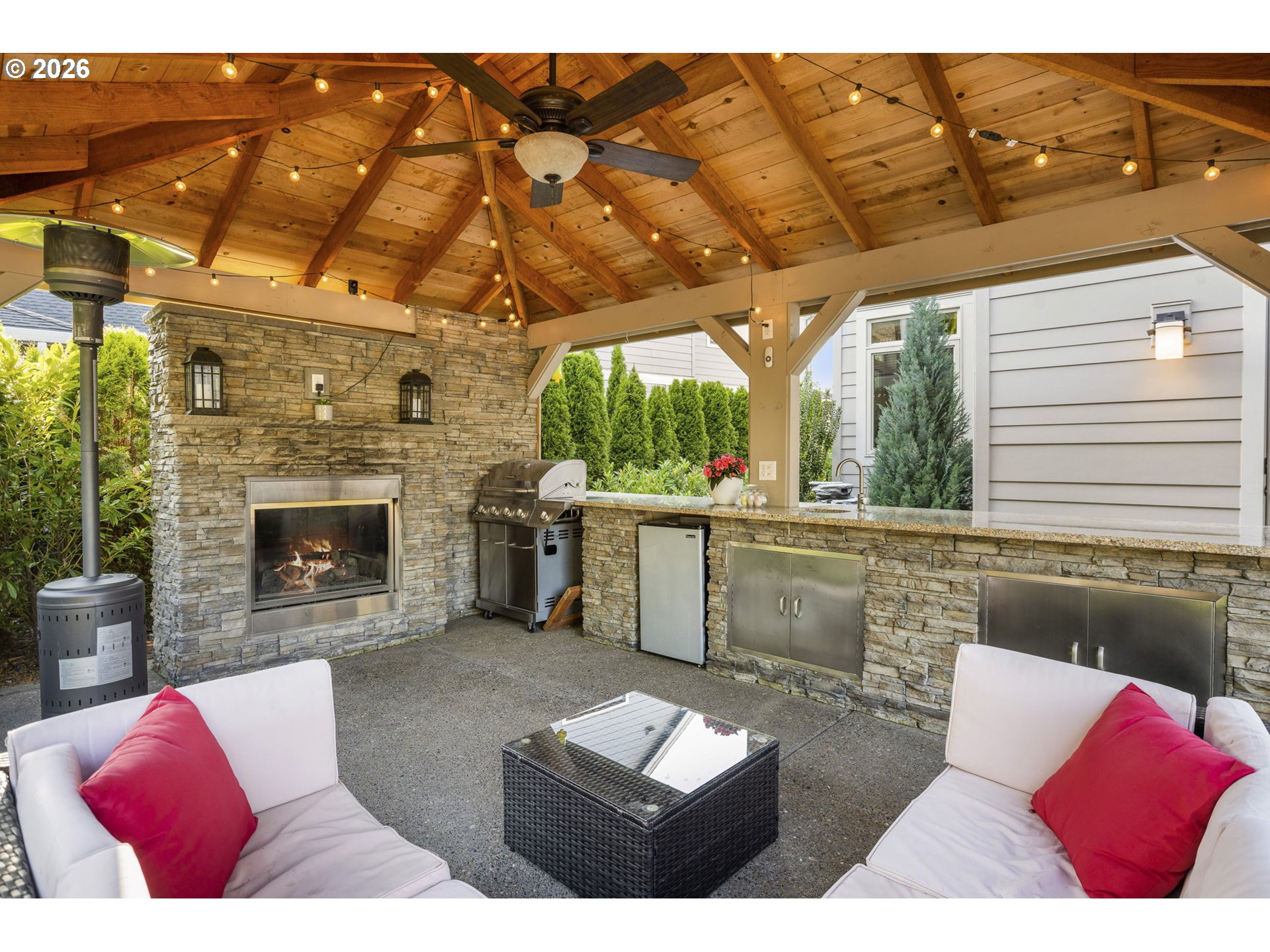 1668 Southeast 35th Terrace Gresham, OR 97080 - Photo 30 of 33 a living room with furniture a fireplace and a table