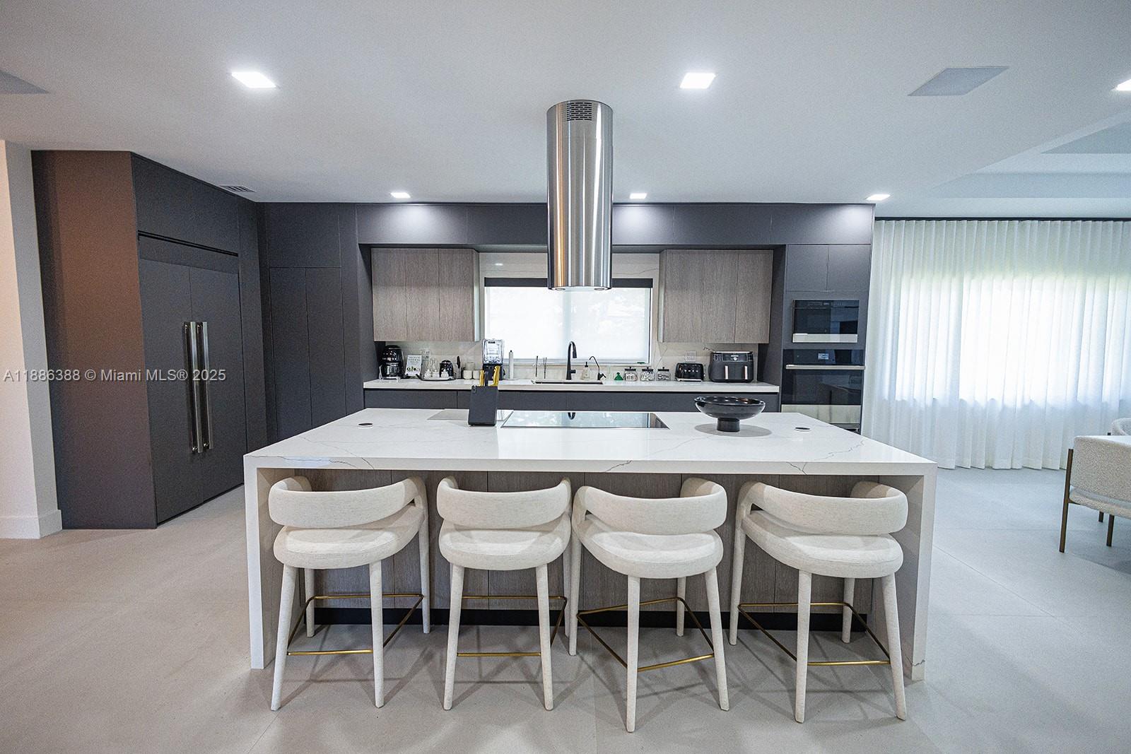 10506 Southwest 89th Place Miami, FL 33176 - Photo 15 of 51 a kitchen with stainless steel appliances granite countertop a sink a stove a refrigerator and chairs