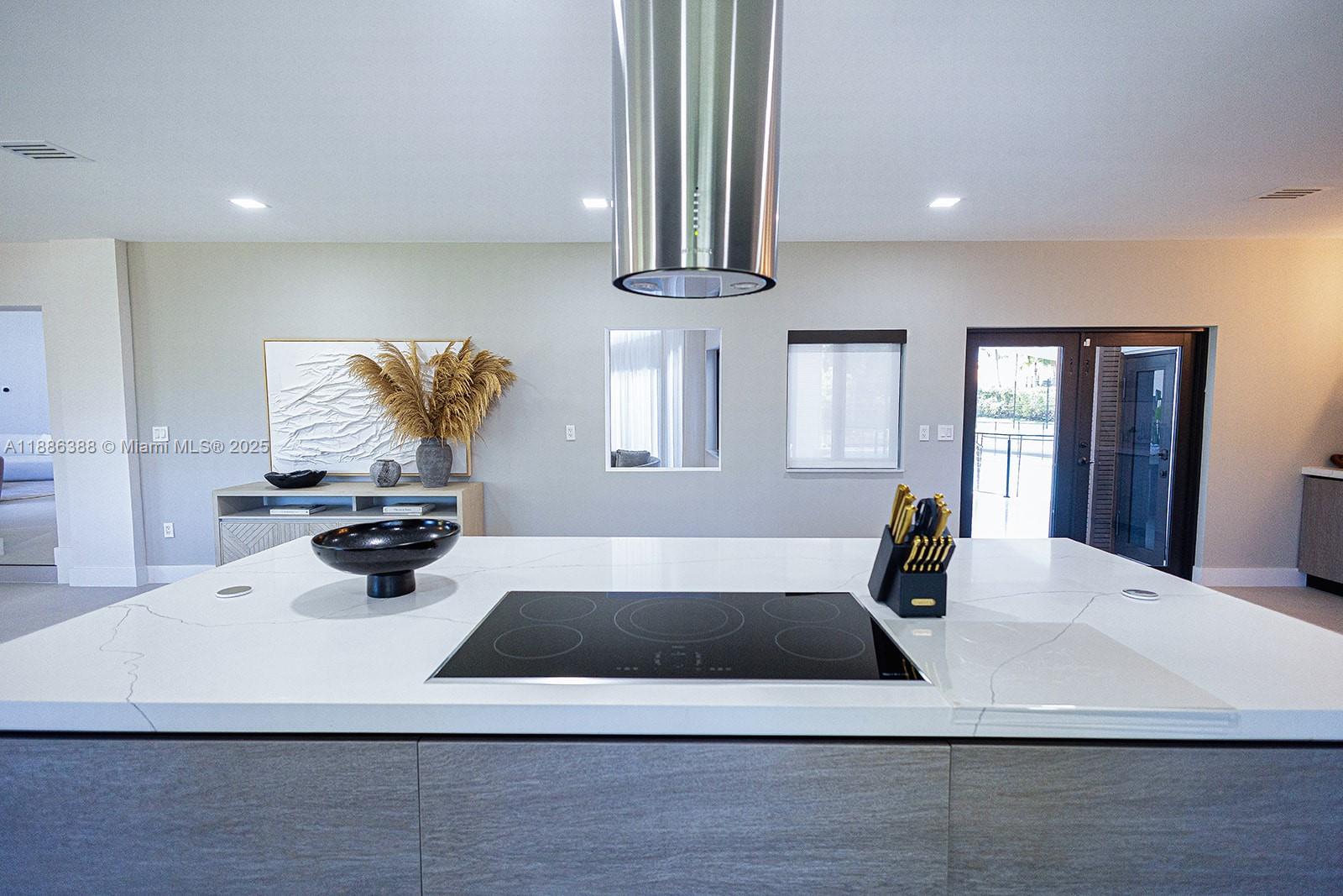 10506 Southwest 89th Place Miami, FL 33176 - Photo 17 of 51 a view of a kitchen with a sink dishwasher refrigerator stove and wooden floor