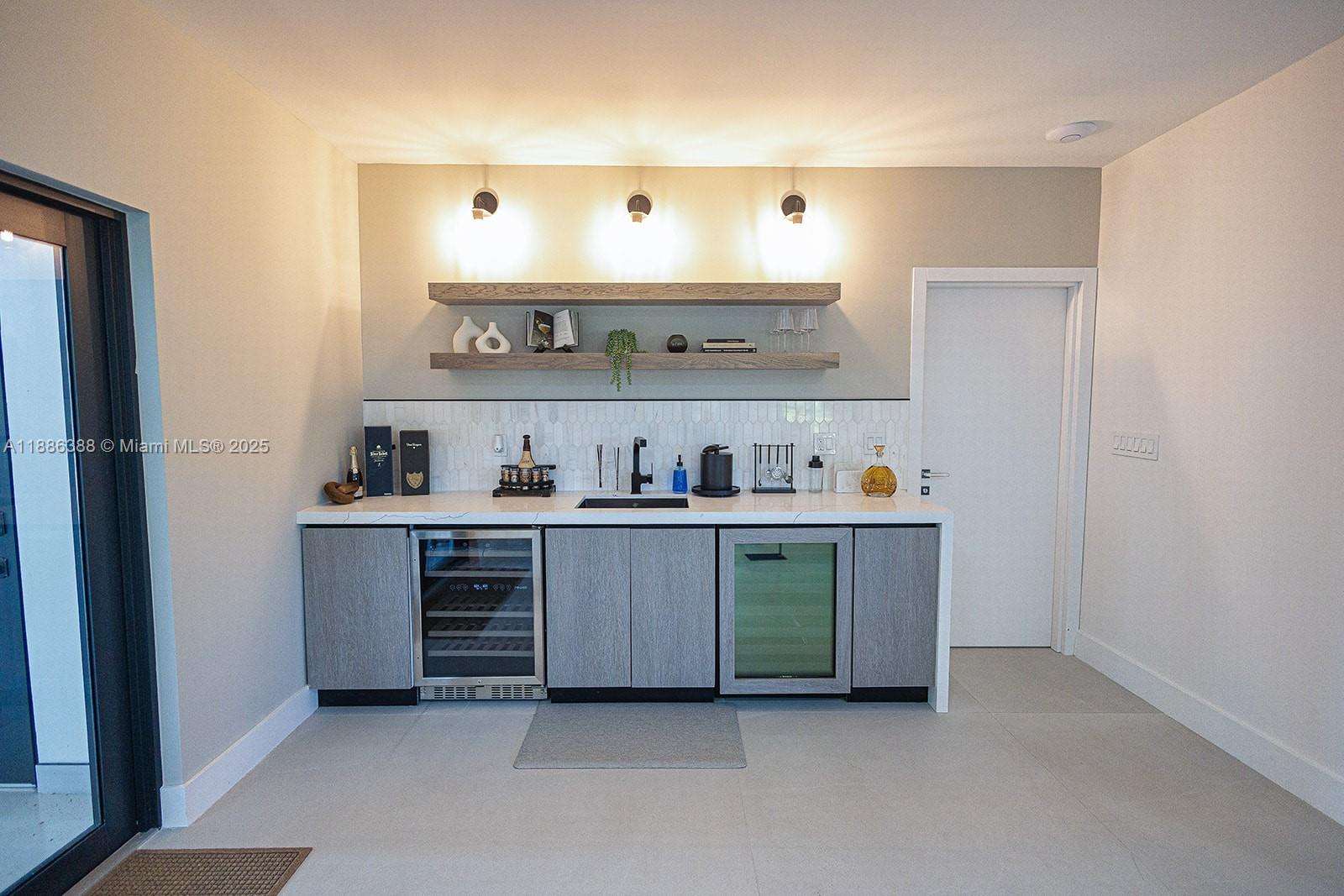 10506 Southwest 89th Place Miami, FL 33176 - Photo 18 of 51 a kitchen with stainless steel appliances a sink and cabinets