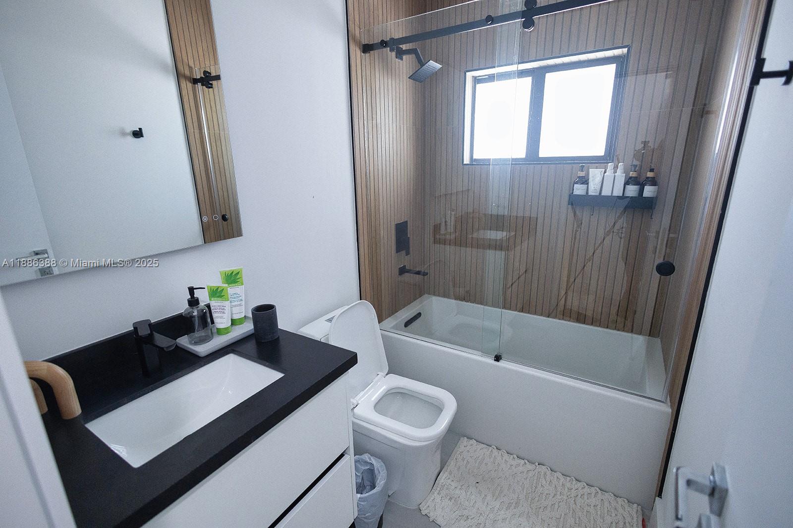 10506 Southwest 89th Place Miami, FL 33176 - Photo 22 of 51 a bathroom with a sink a toilet and shower