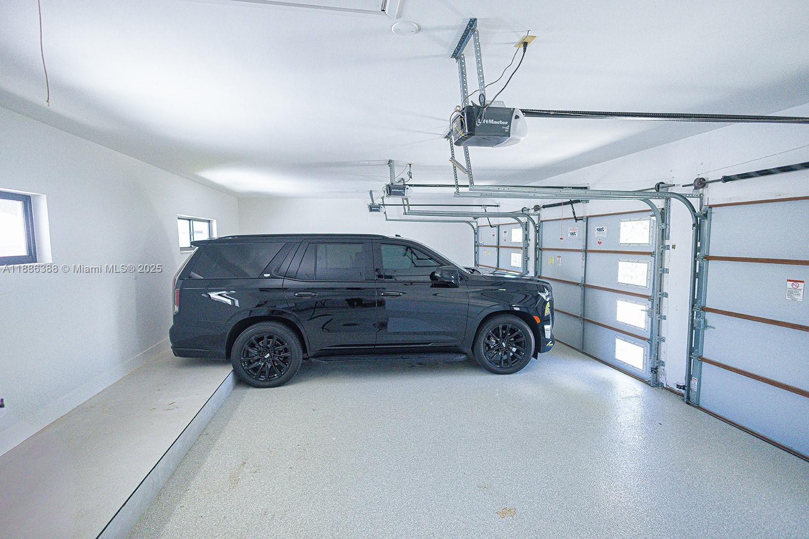 10506 Southwest 89th Place Miami, FL 33176 - Photo 24 of 51 a view of parking garage with cars