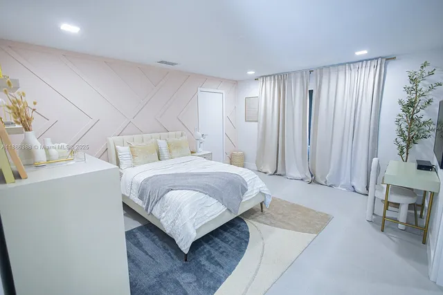 a bedroom with a bed and a table in it