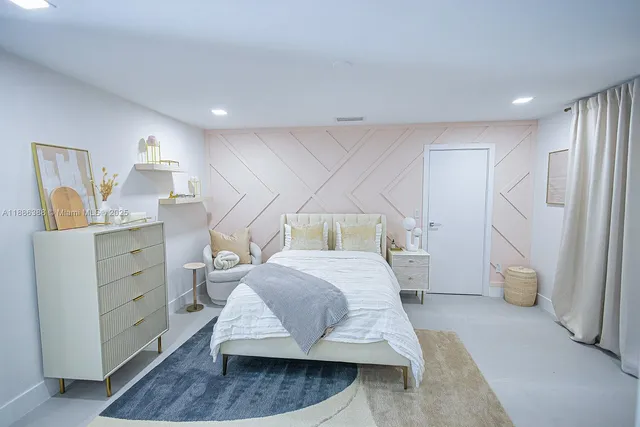 a bed room with a bed and a cabinets