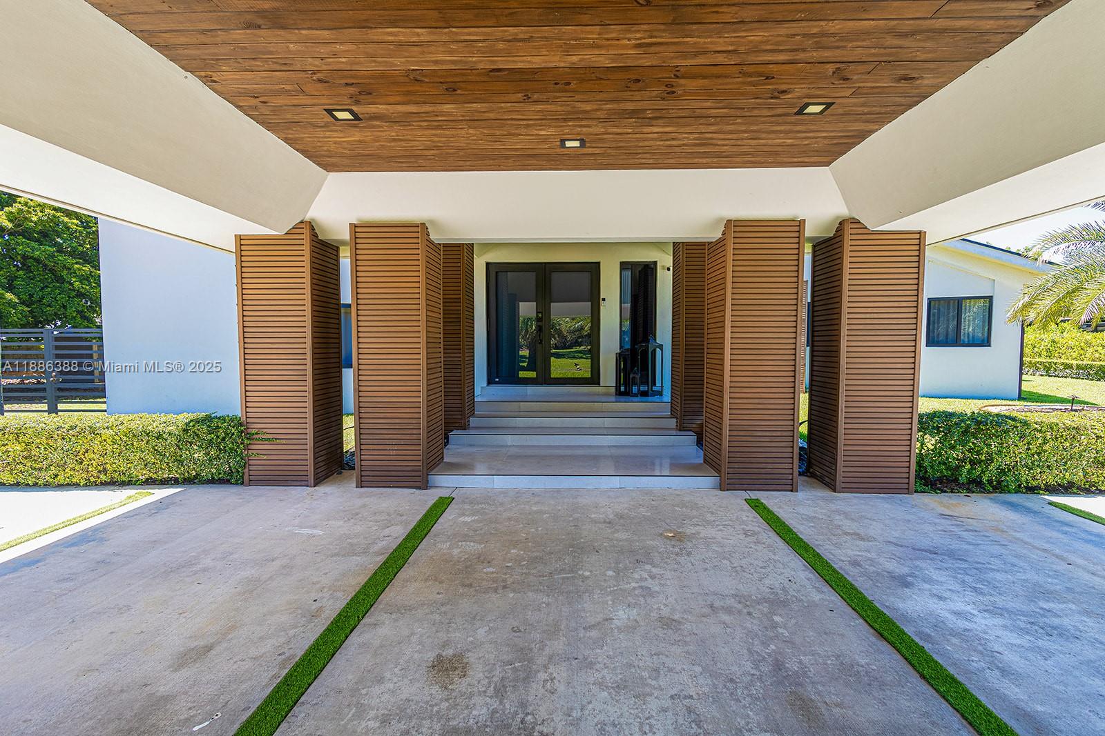 10506 Southwest 89th Place Miami, FL 33176 - Photo 4 of 51 a front view of a house with a porch
