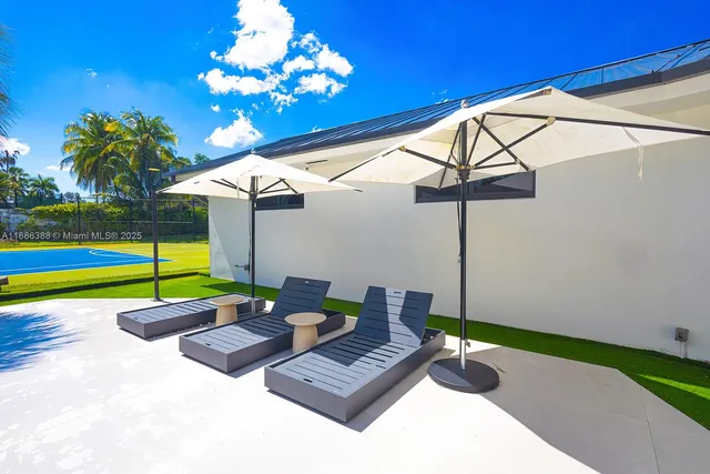 a view of swimming pool with seating area