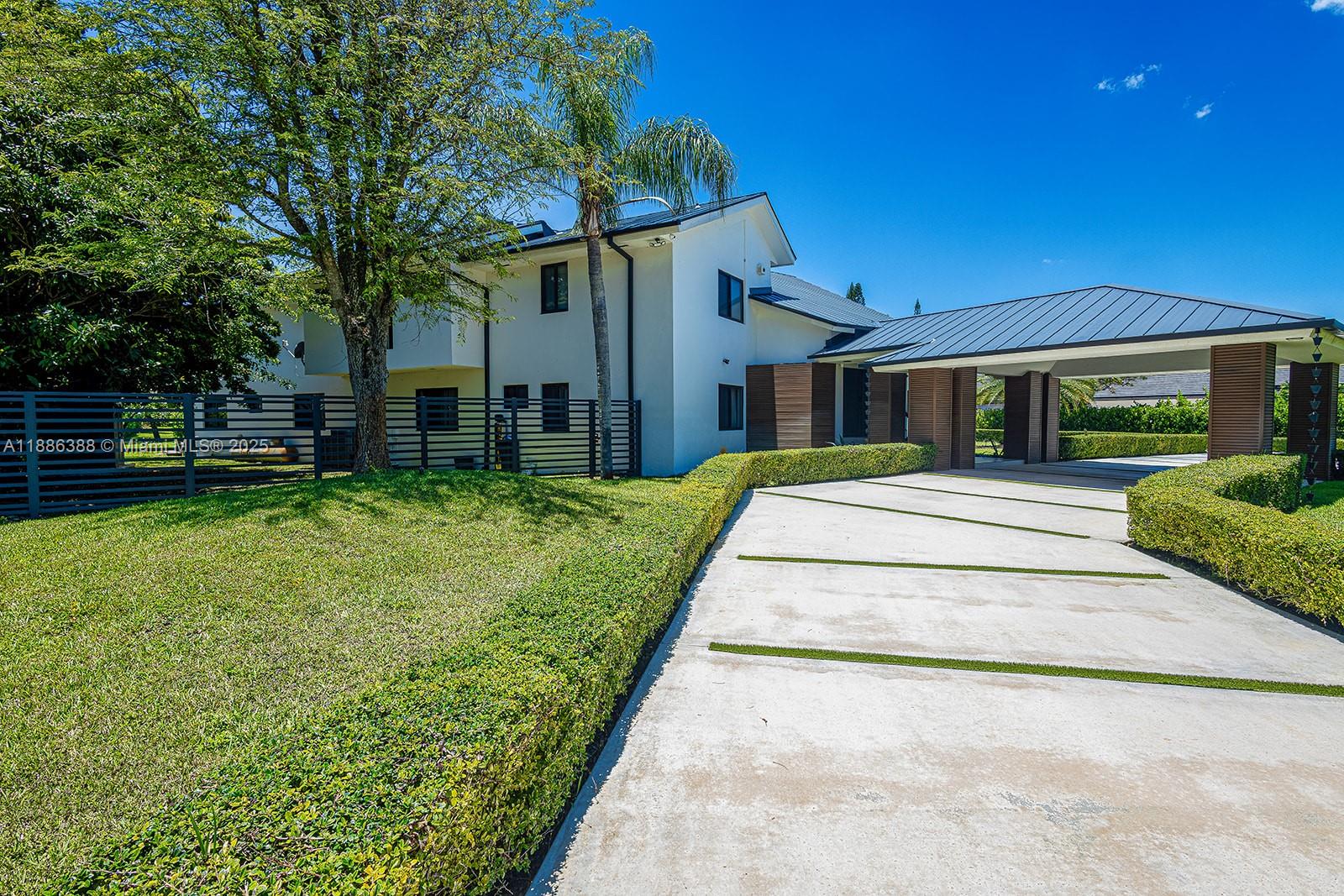 10506 Southwest 89th Place Miami, FL 33176 - Photo 5 of 51 a view of a house with a yard
