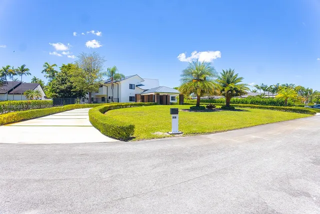 a view of a swimming pool with an outdoor space and seating area