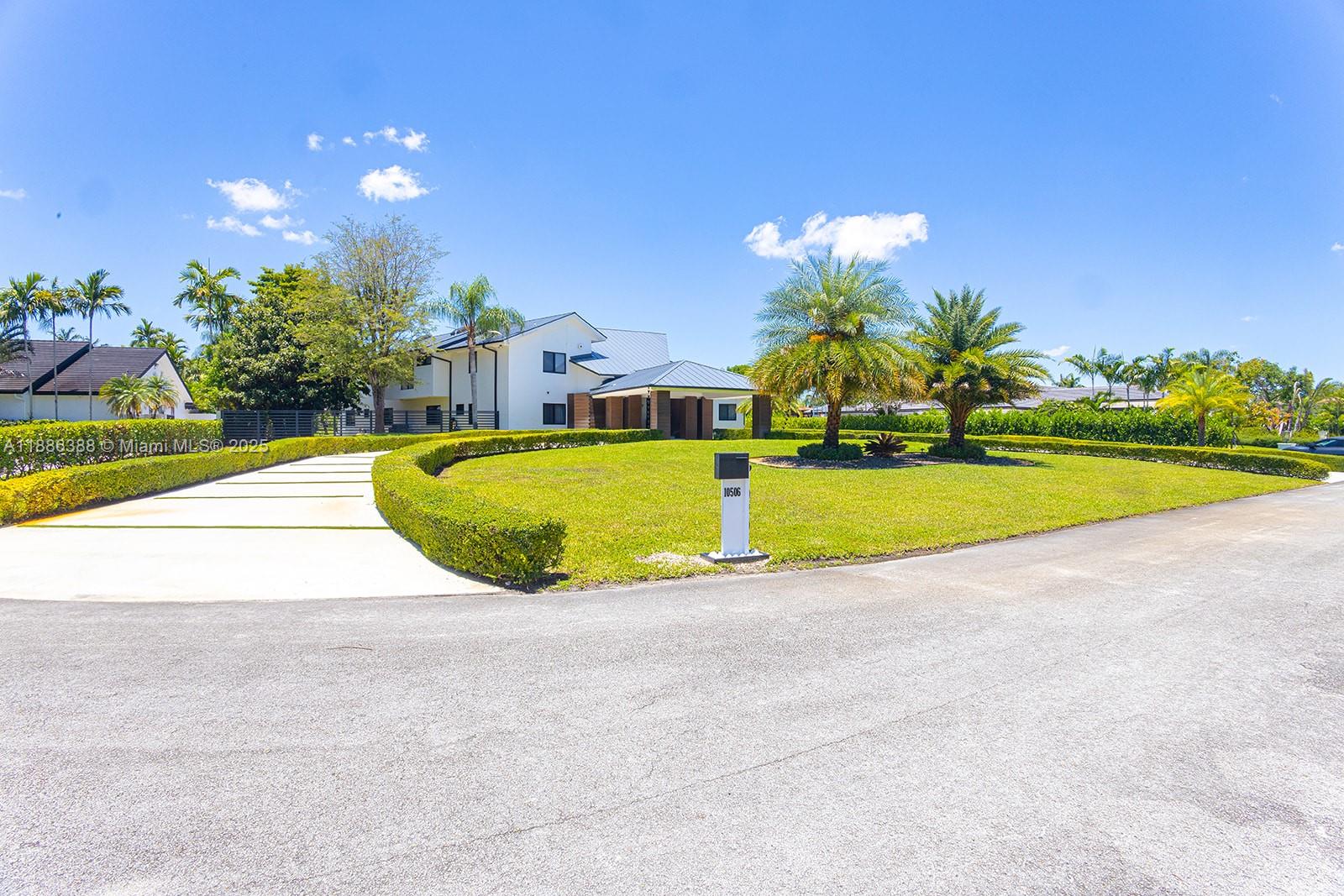 10506 Southwest 89th Place Miami, FL 33176 - Photo 6 of 51 a view of a swimming pool with an outdoor space and seating area