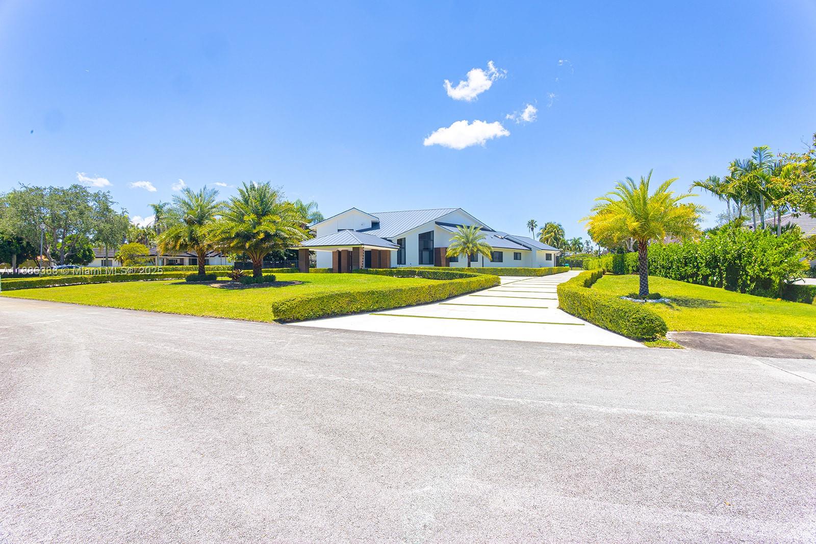 10506 Southwest 89th Place Miami, FL 33176 - Photo 7 of 51 a view of a swimming pool with an outdoor space and seating area