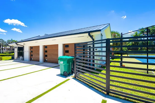 a view of a patio with a table and chairs