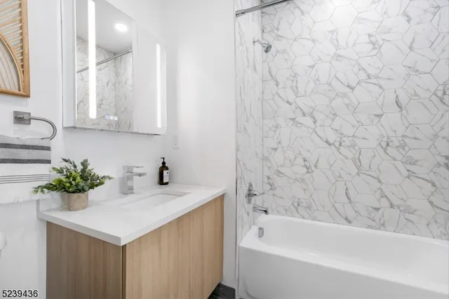 a bathroom with a sink and a bathtub