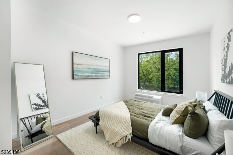 803 South Avenue, Unit 510 Plainfield, NJ 07062 - Photo 21 of 47 a bed room with a bed and a window