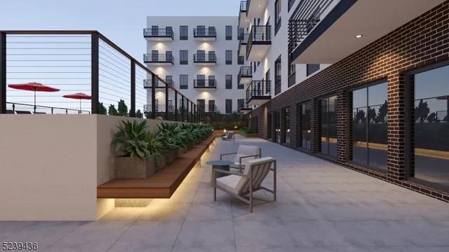 a balcony with furniture and a potted plant