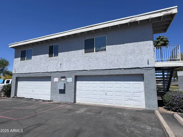 a front view of a house with garage