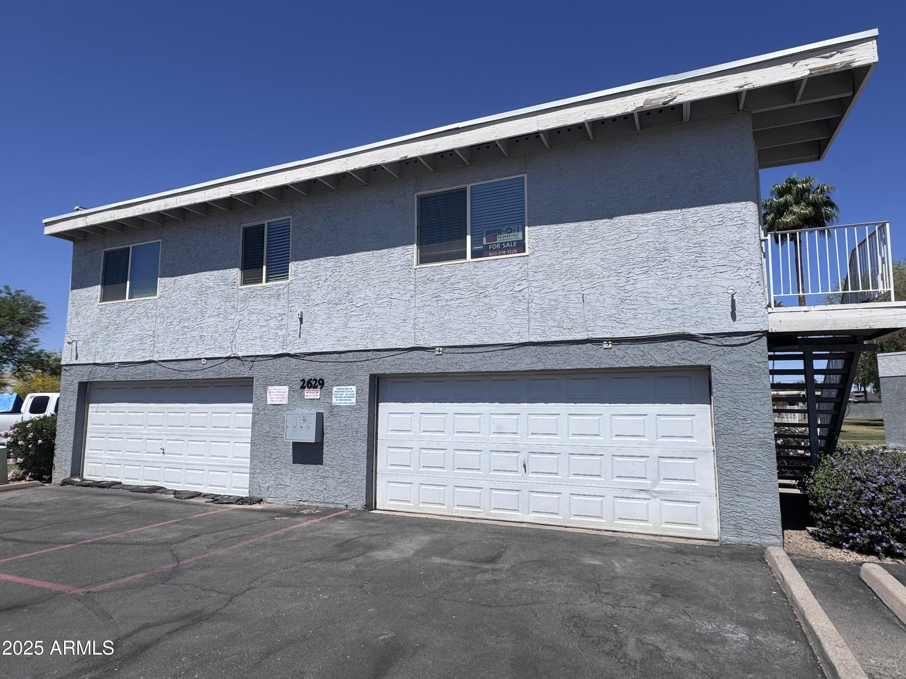 a front view of a house with garage