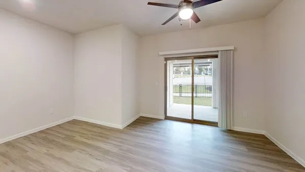 a view of an empty room with a closet