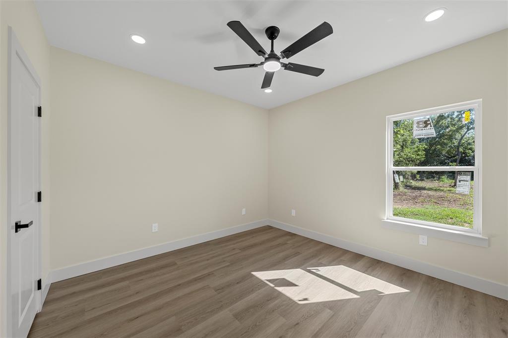 3320 North 27th Street Waco, TX 76708 - Photo 26 of 38 wooden floor in an empty room with a window