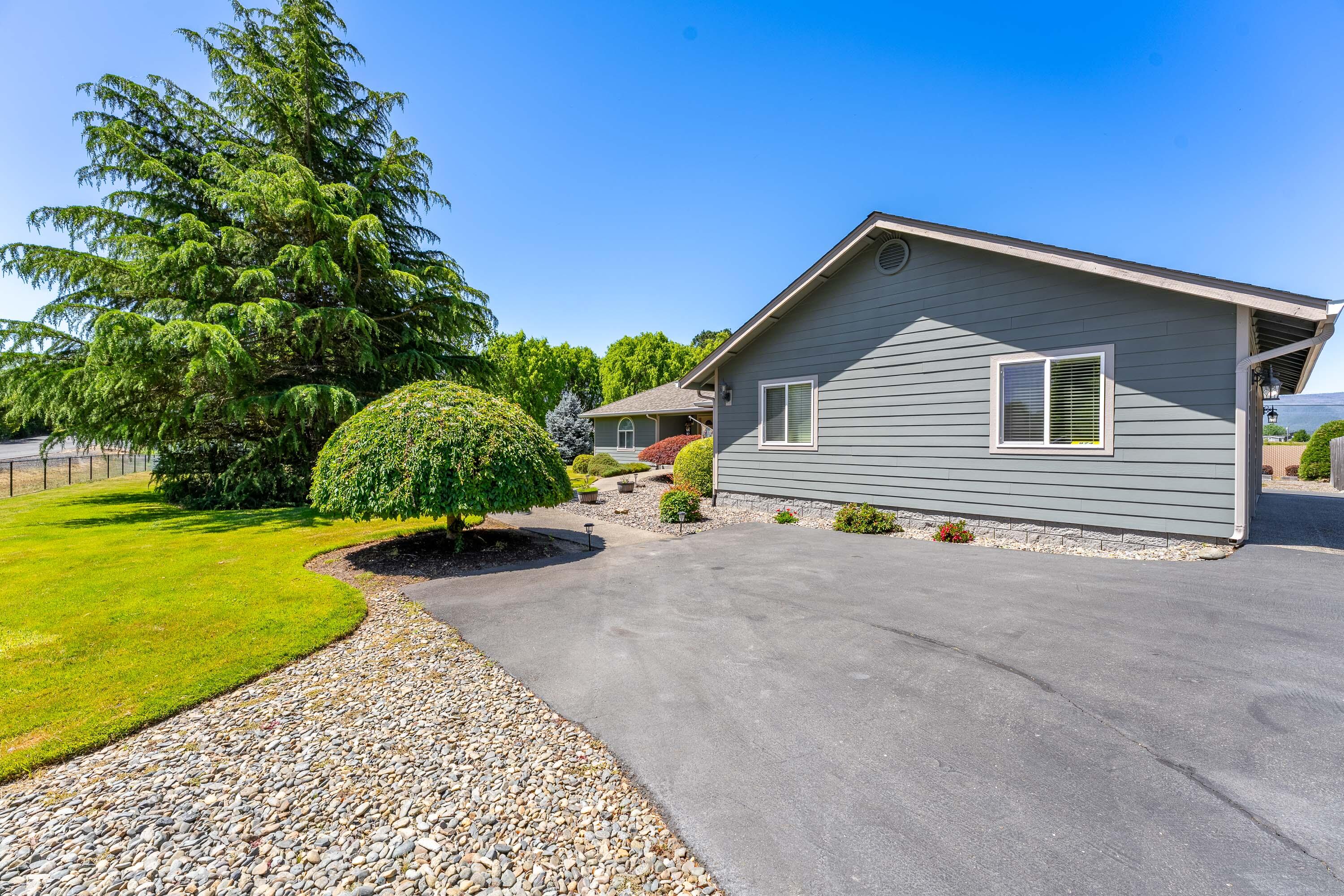 974 Felicia Lane Grants Pass, OR 97527 - Photo 5 of 36 a view of a house with a yard and garage
