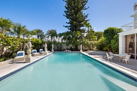 a view of a swimming pool with a patio