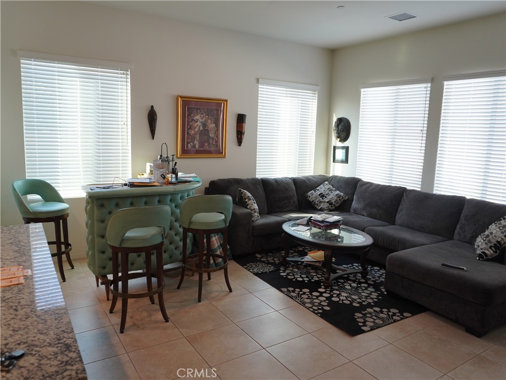 348 Scarlett Runner Beaumont, CA 92223 - Photo 22 of 33 a living room with furniture and a table
