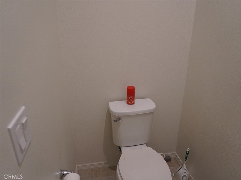 348 Scarlett Runner Beaumont, CA 92223 - Photo 31 of 33 a white toilet sitting next to a white sink