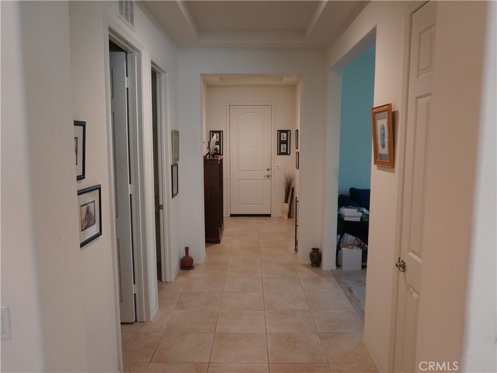 348 Scarlett Runner Beaumont, CA 92223 - Photo 8 of 33 a view of a hallway with closet and bathroom